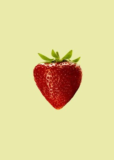 Freshly harvested vibrant red strawberries with dew drops